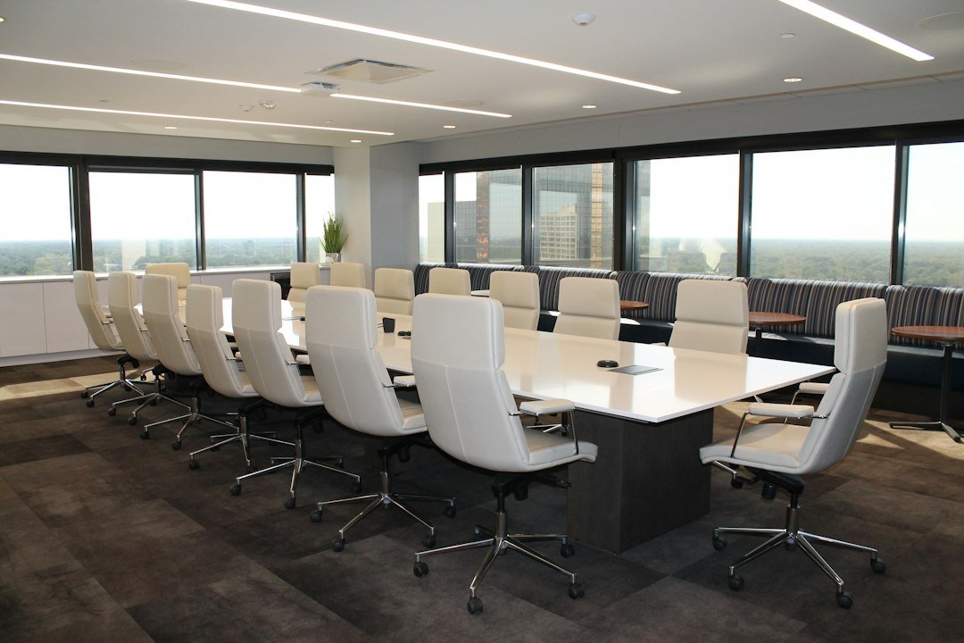Empty conference room representing a corporate legal settlement