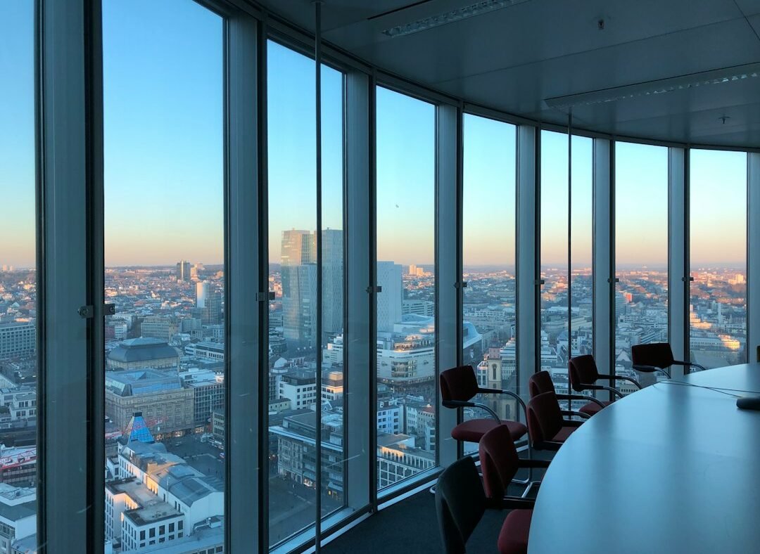 Empty corporate boardroom with a view of the city skyline