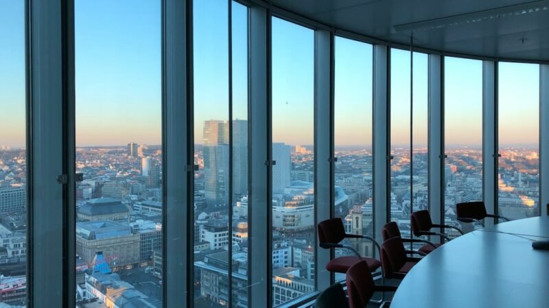 Empty corporate boardroom with a view of the city skyline