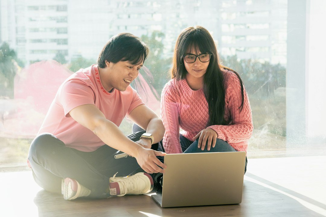 Couple working together on a side hustle at home