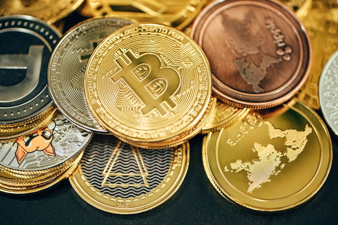 A pile of cryptocurrency coins on a black background, representing digital agent payments