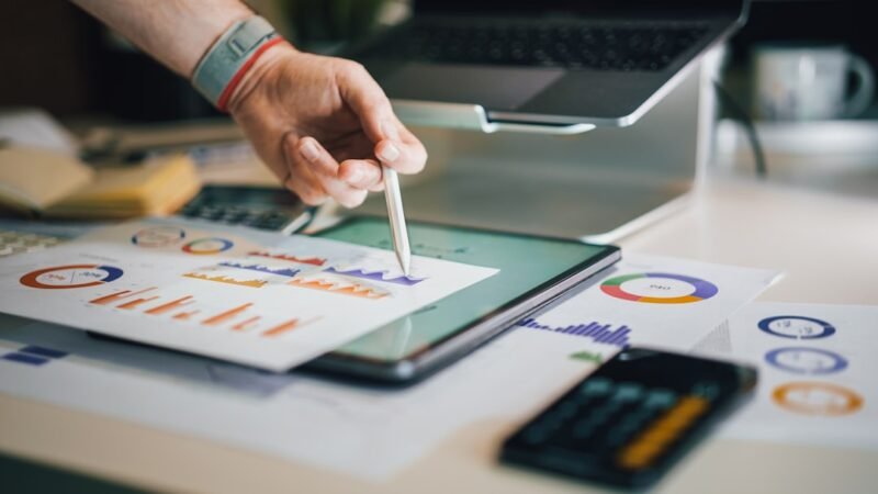 Financial report data presentation with charts and graphs on a desk