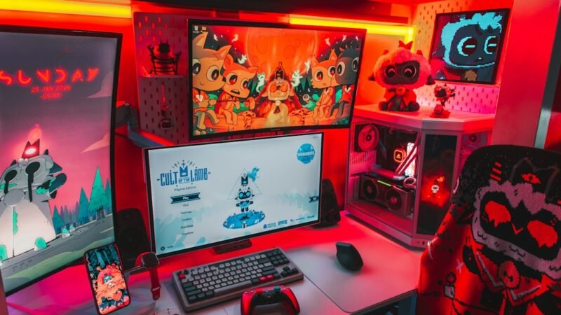 Multi-monitor gaming and game design setup with RGB lighting