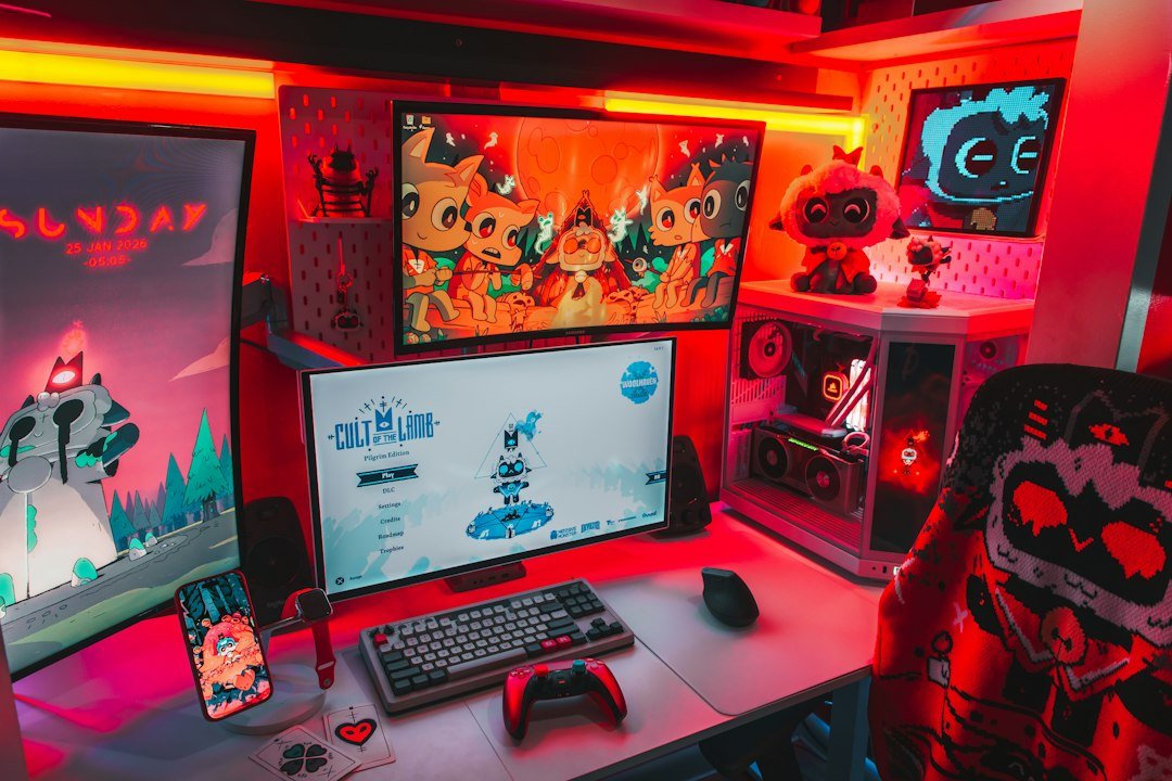 Multi-monitor gaming and game design setup with RGB lighting