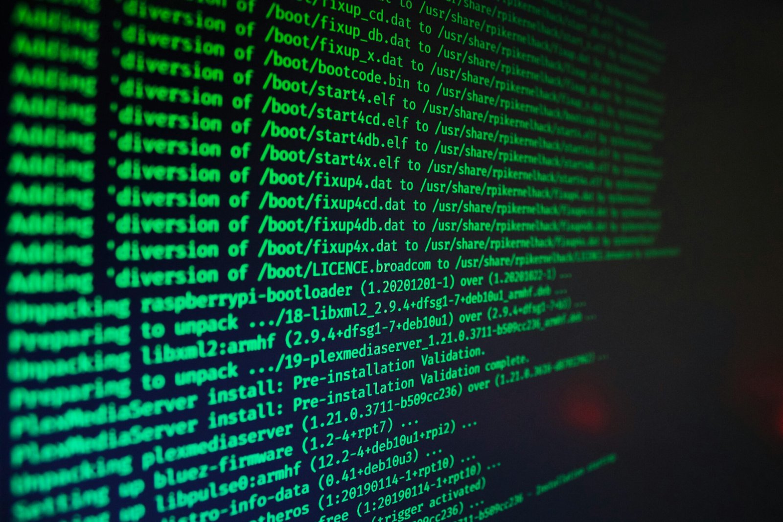 Lines of code scrolling on a dark computer screen, representing a cybersecurity intrusion