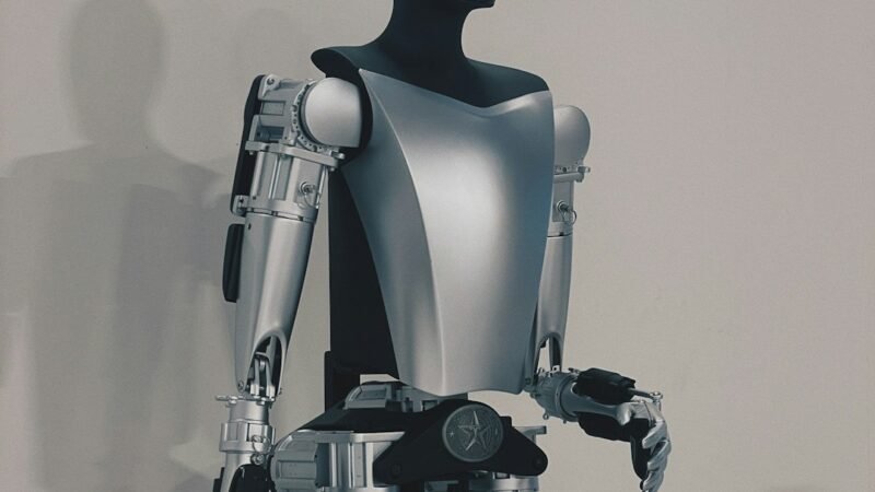 Small robot standing against a white background, representing a consumer robotics product