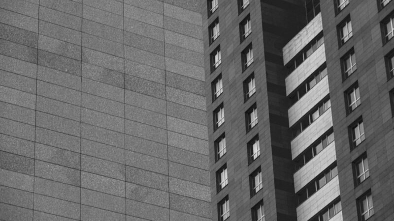 Exterior facade of a modern apartment building with repeating windows