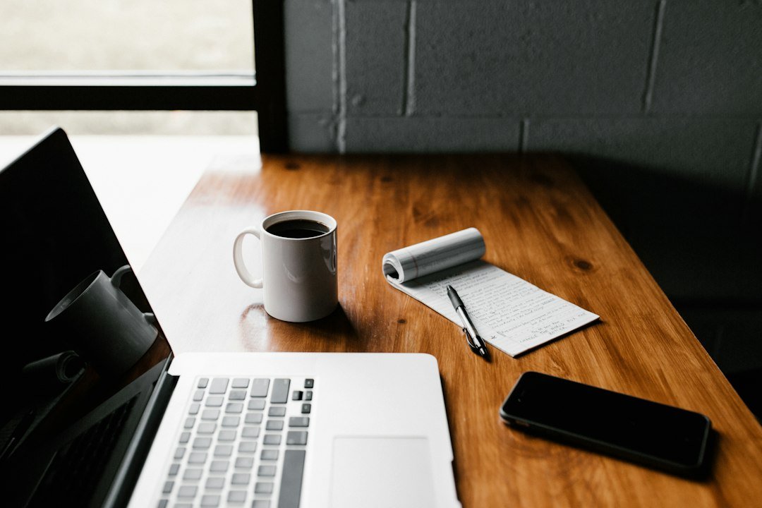Laptop on an office desk representing productivity software and AI assistants