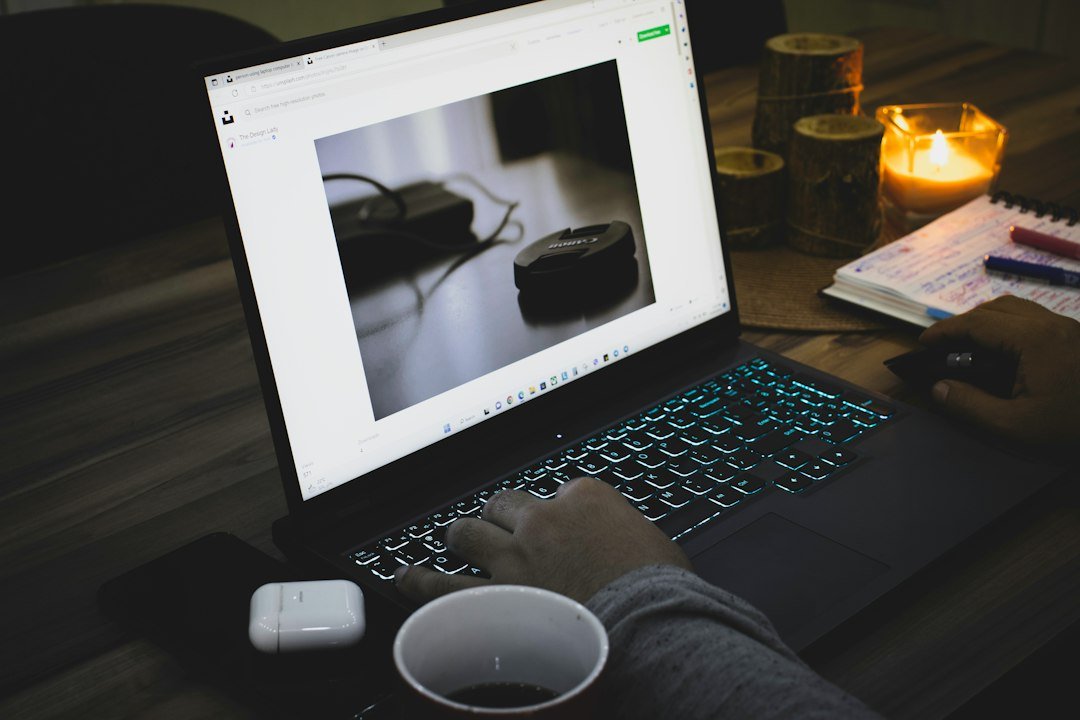 Hands typing on a laptop at a home workspace for part-time remote work