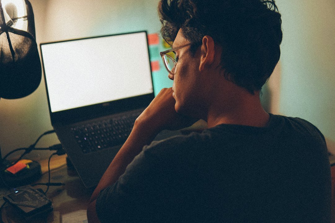 Person managing client tasks on a laptop computer for a part-time virtual assistant job