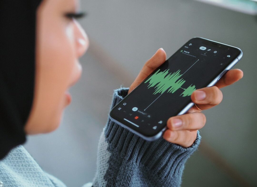 Person holding a smartphone to talk