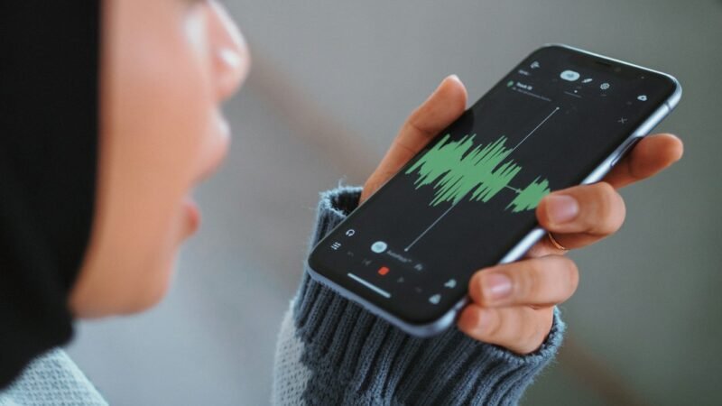 Person holding a smartphone to talk