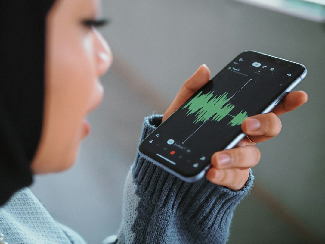 Person holding a smartphone to talk