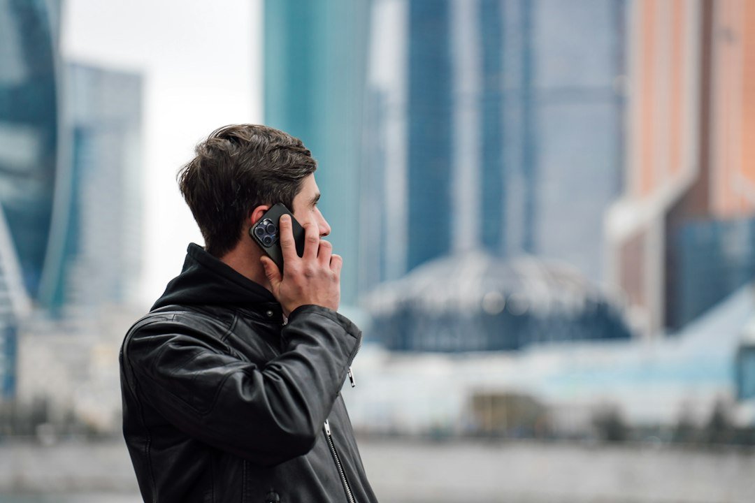 Person using a smartphone on a city street