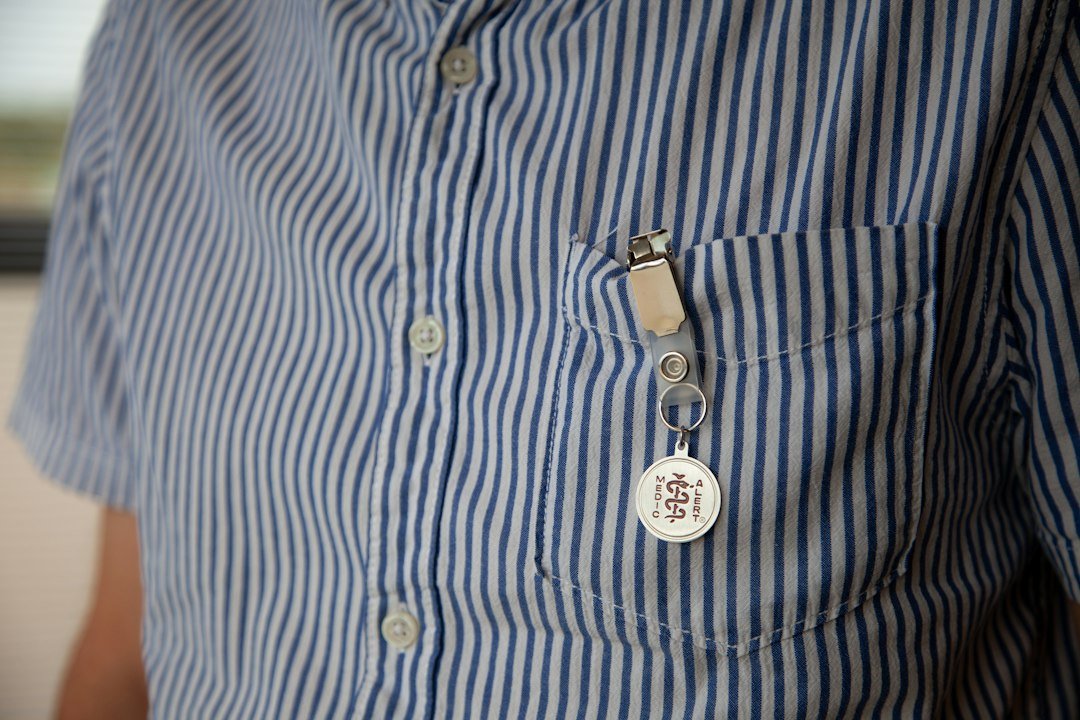 Person wearing a small clip-on wearable device