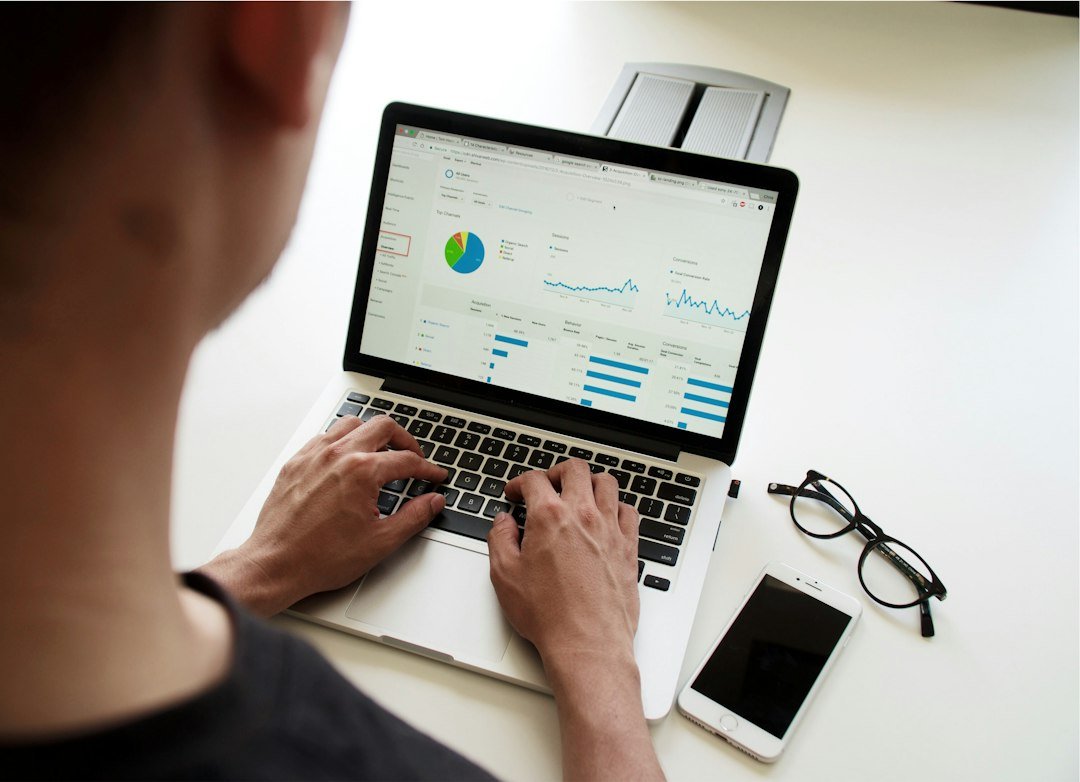 Person working on a laptop reviewing data