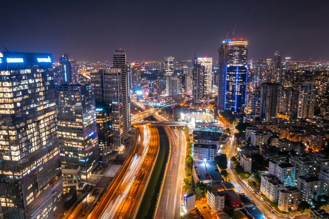 City financial district skyline at night representing fintech growth