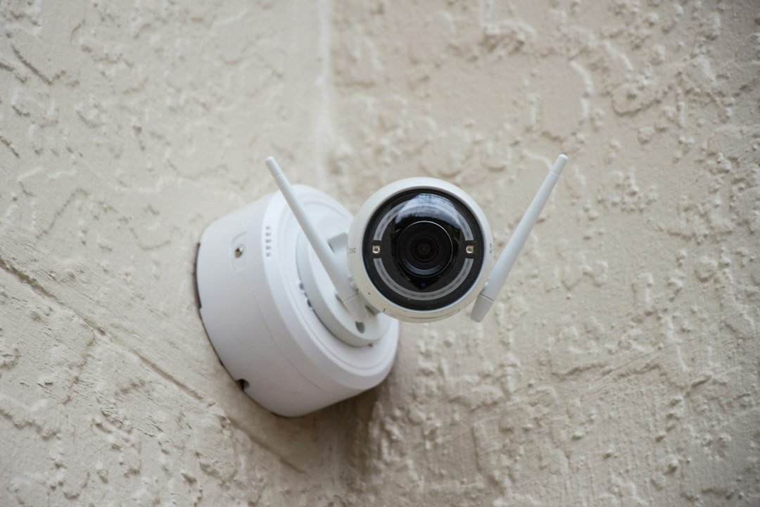 A home security camera mounted on a wall, representing Ring's new 4K camera lineup