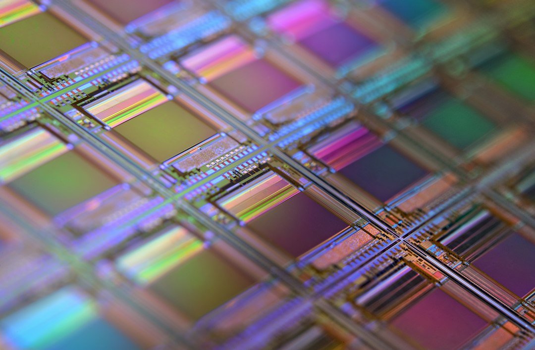 A macro photograph of a silicon memory chip wafer