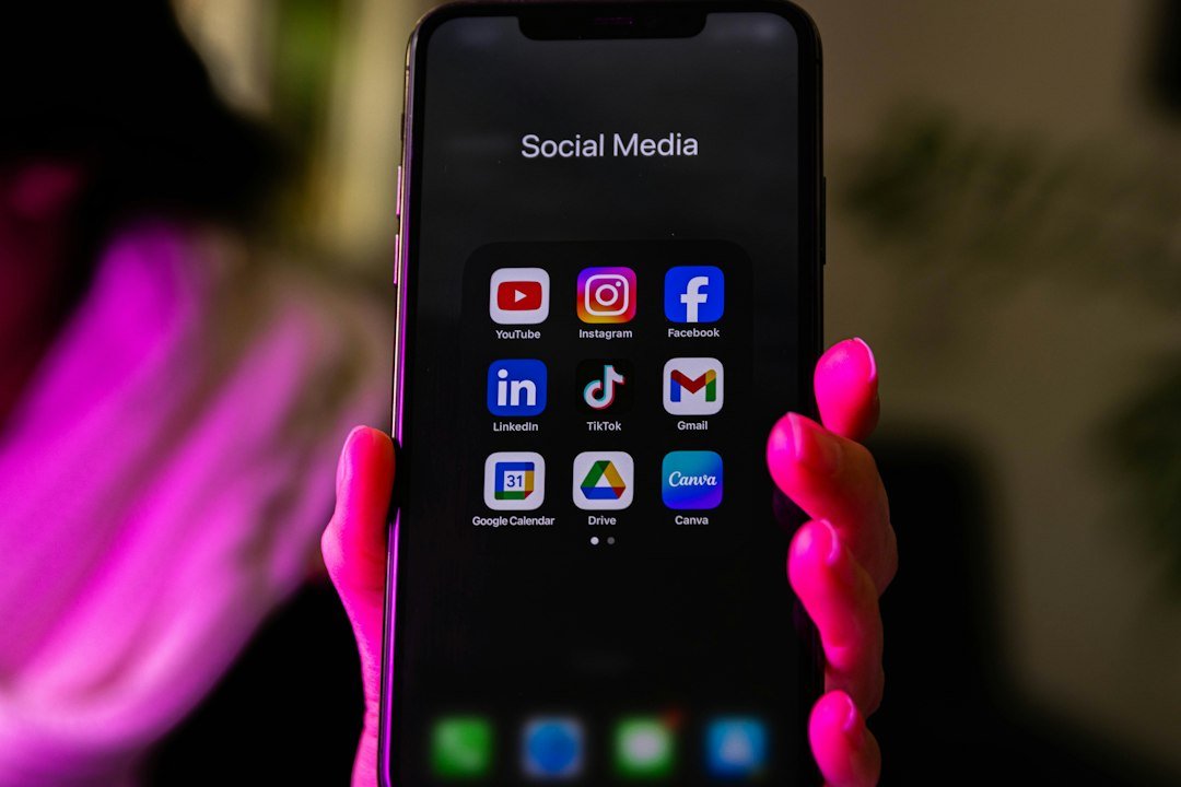 Smartphone displaying a folder of social media app icons