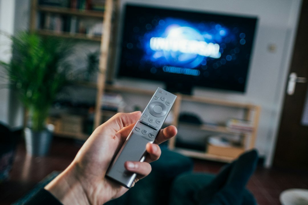 Television screen in a living room representing a streaming homepage