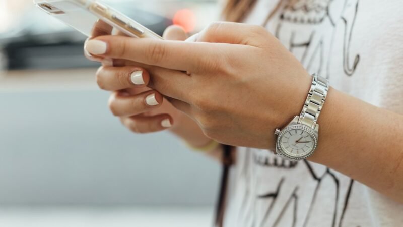 Woman texting friends about weekend plans, illustrating what WTW means in text