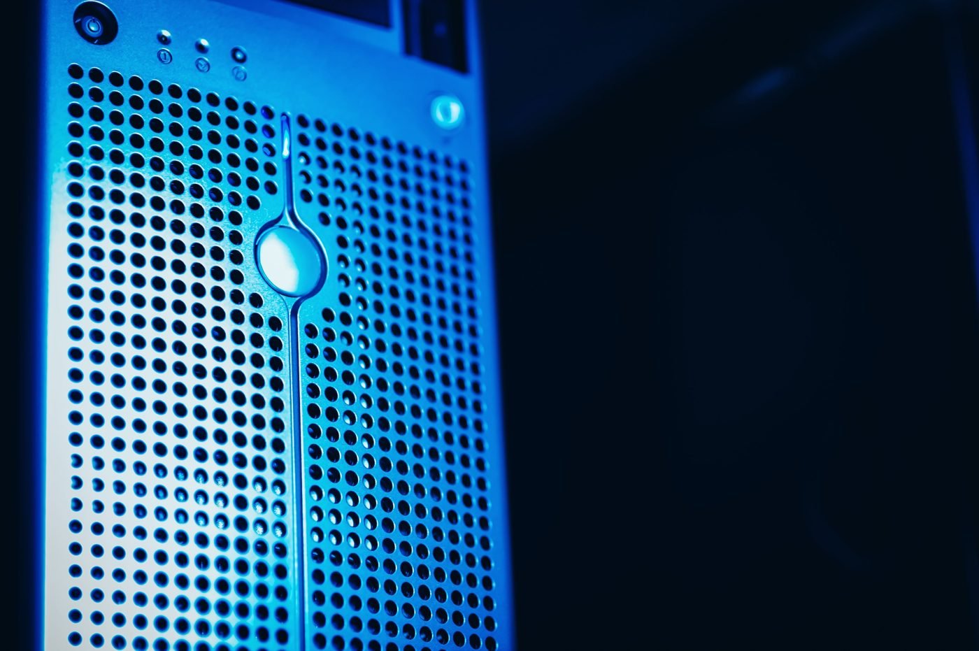 Server racks lit in blue inside a data center