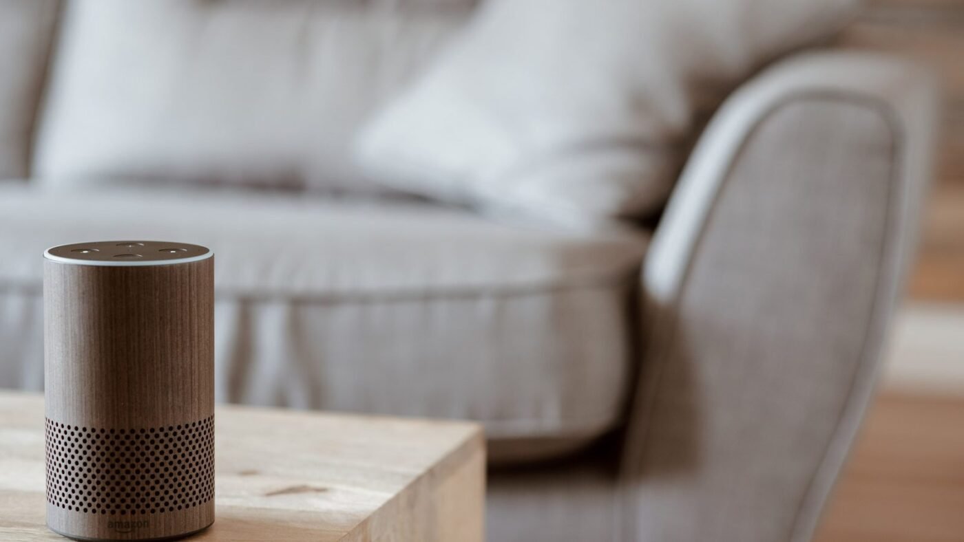 Smart speaker on a wooden table in a living room