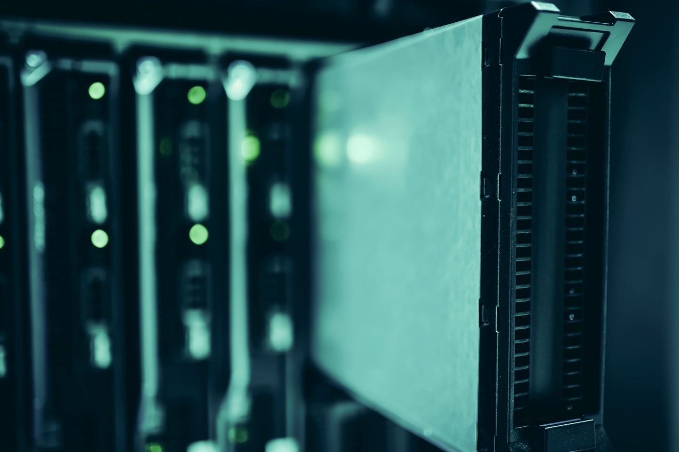 Rows of illuminated servers in a modern data center aisle