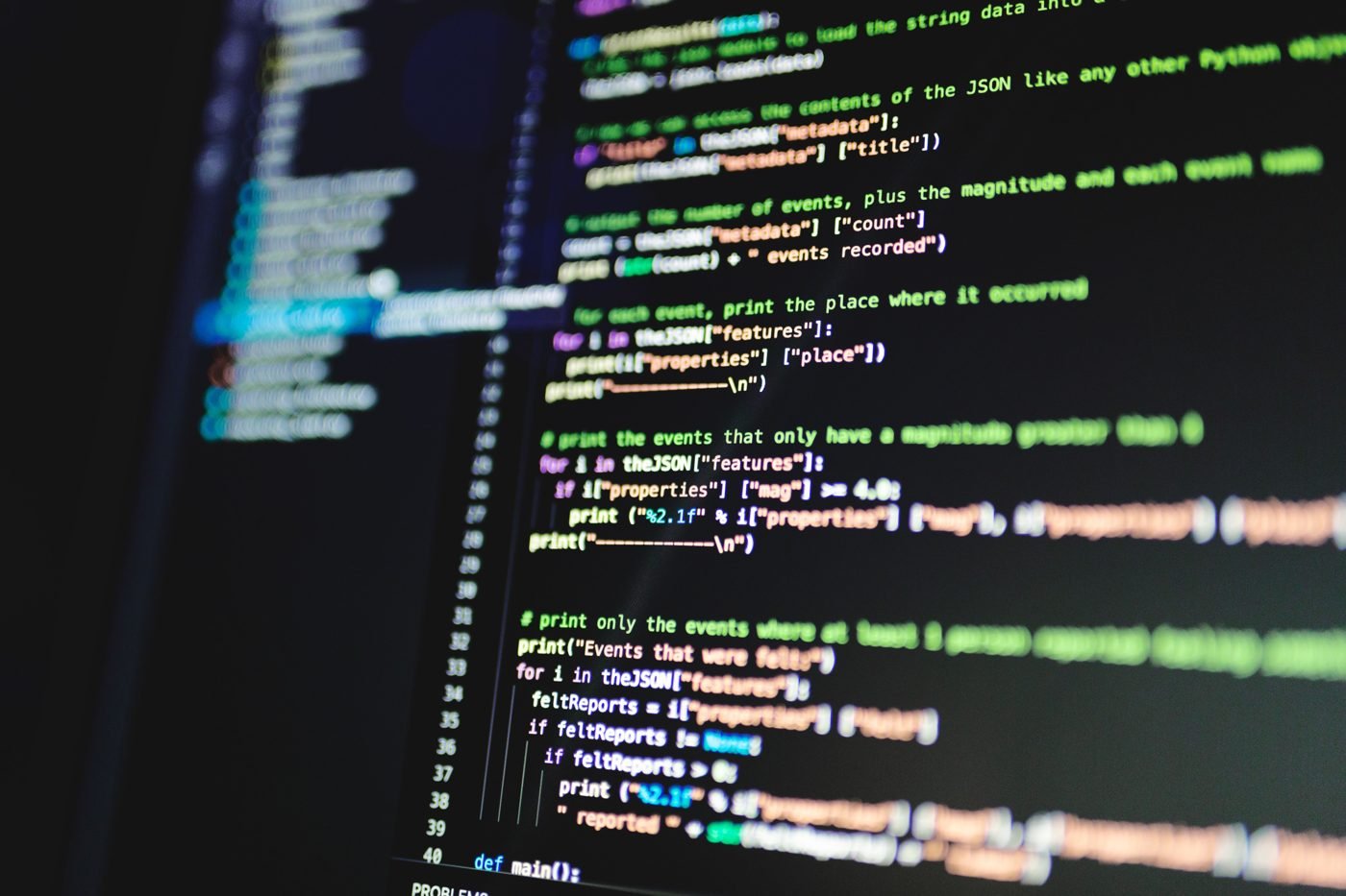 Colorful programming code on a dark computer monitor
