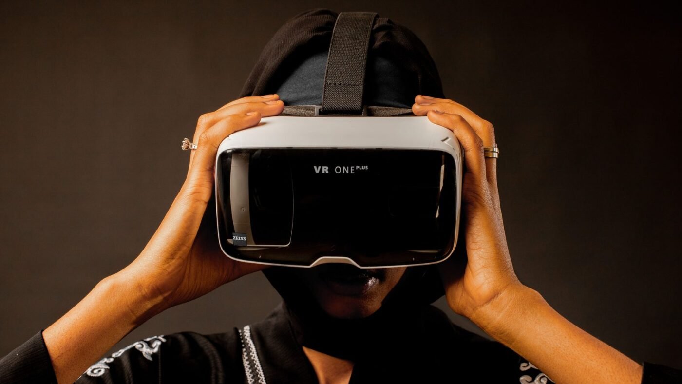 Person wearing a virtual reality headset in a dark room
