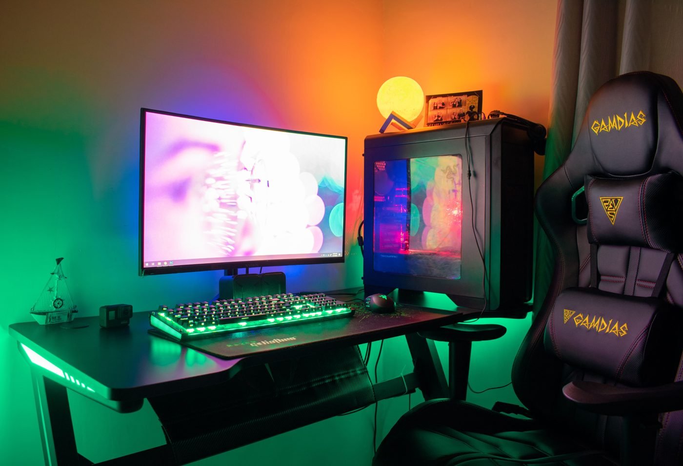 Colorful gaming PC setup with RGB lighting in a dark room
