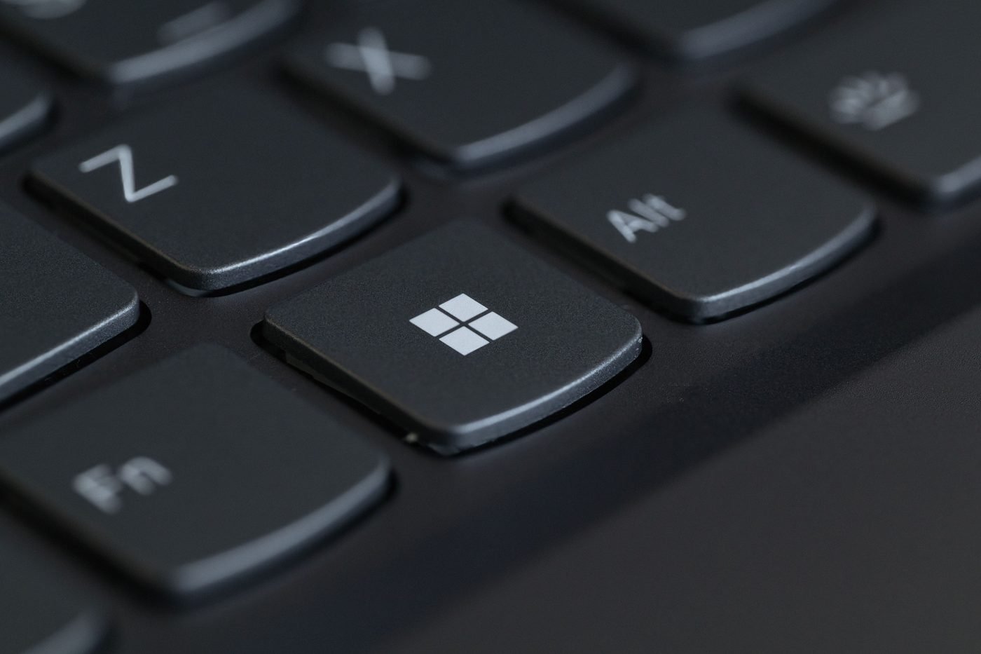 Close-up of a laptop keyboard with the Windows key