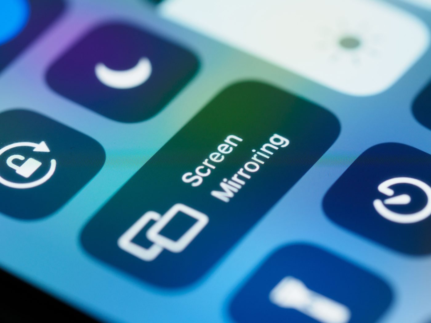Close-up of an iPhone Control Center with the Screen Mirroring button