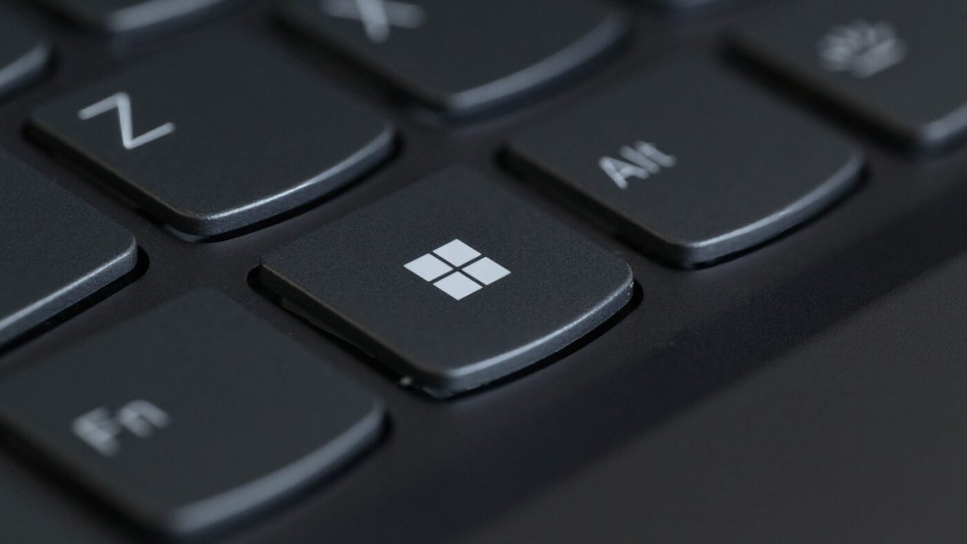 Close-up of a computer keyboard with the Windows key in focus