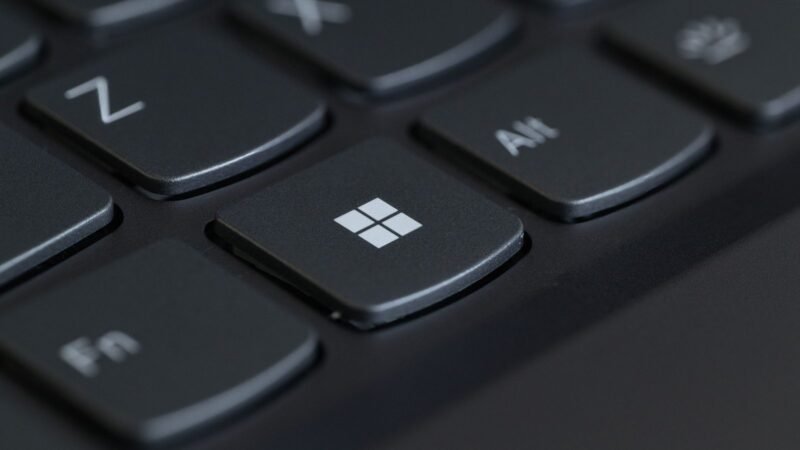 Close-up of a computer keyboard with the Windows key in focus