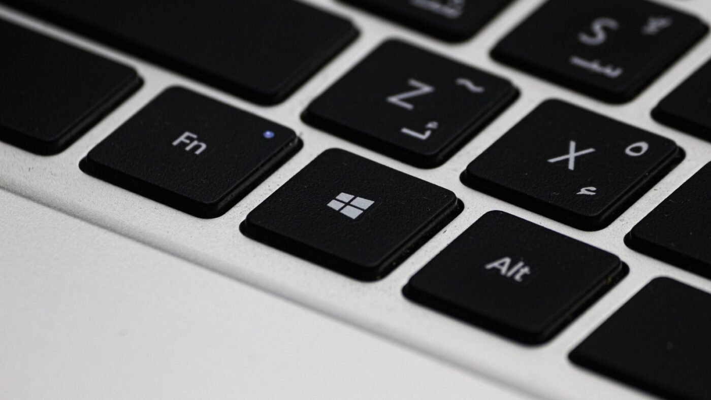 Close-up of a laptop keyboard highlighting the Windows logo key