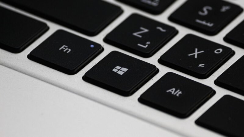 Close-up of a laptop keyboard highlighting the Windows logo key
