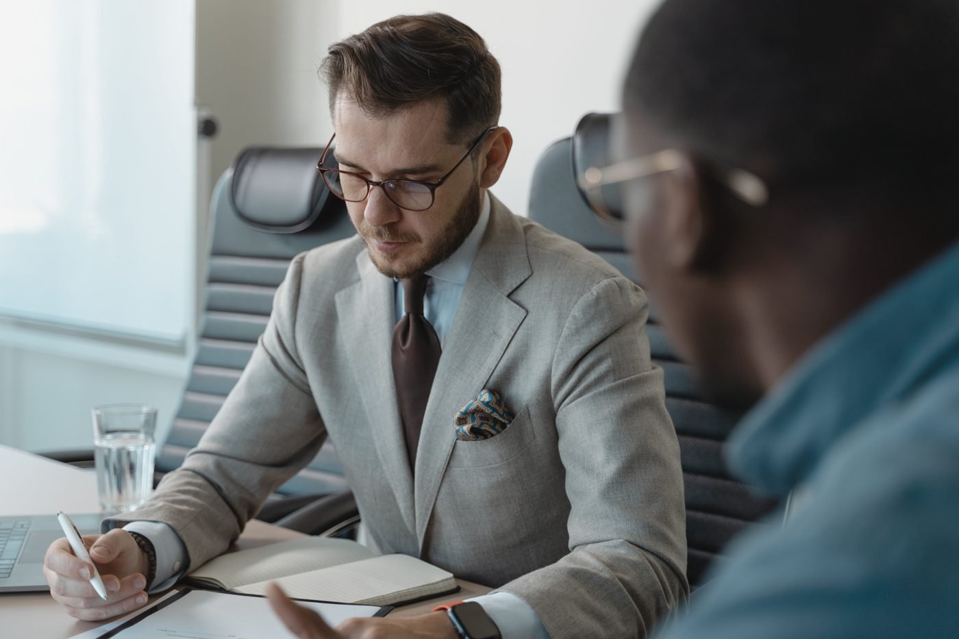 Two professionals having a focused one-on-one discussion in an office