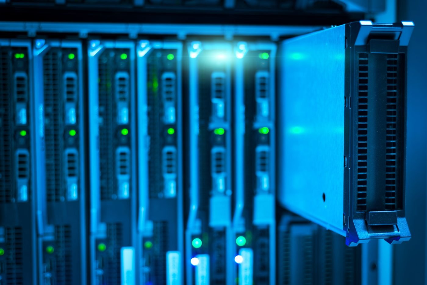 Close-up of a server rack with glowing blue lights in a data center