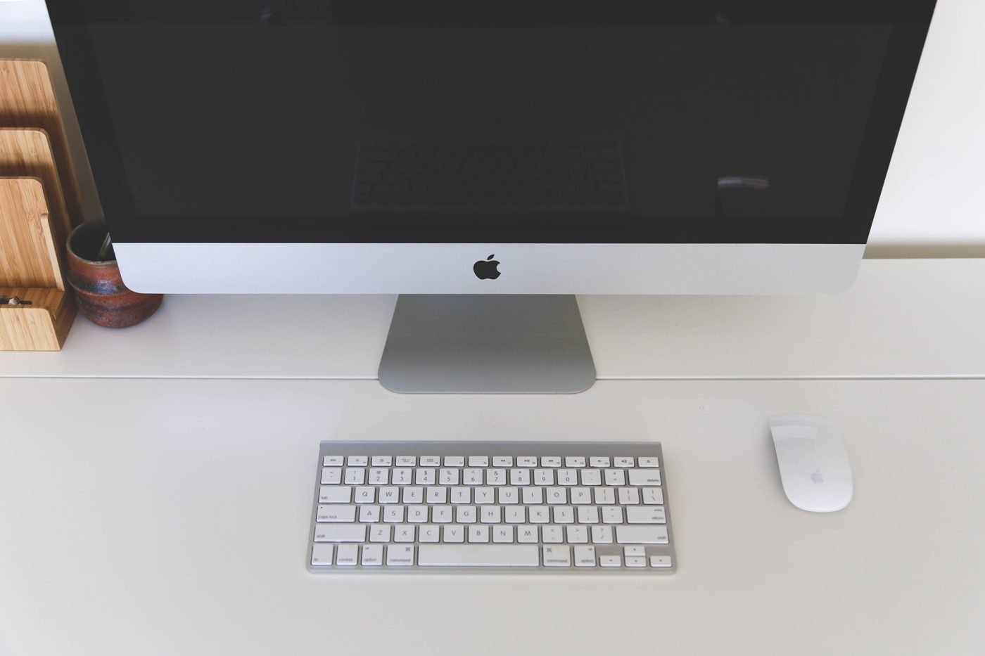 White desktop computer with keyboard and mouse on a desk
