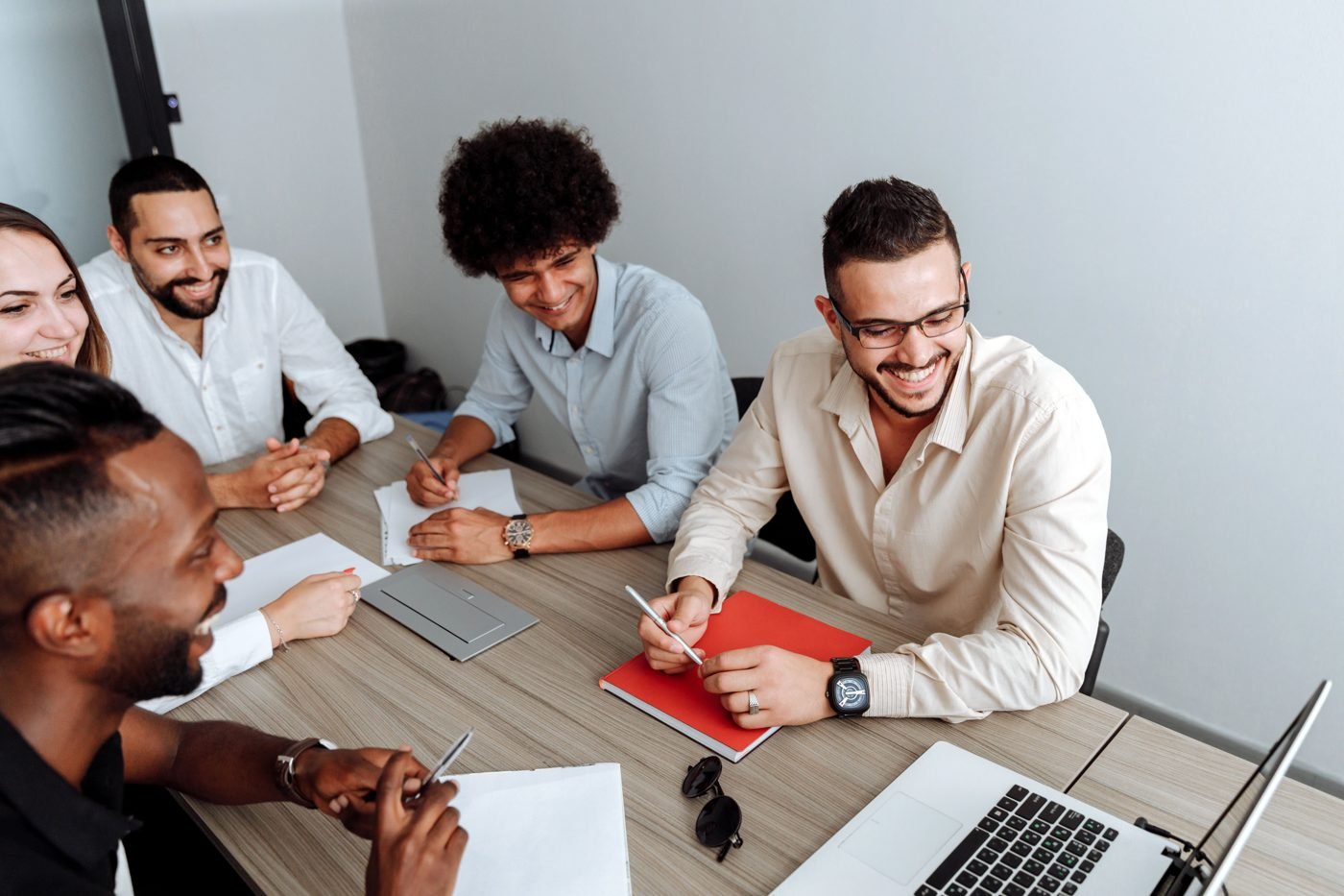 Team of professionals collaborating around a table in a modern office