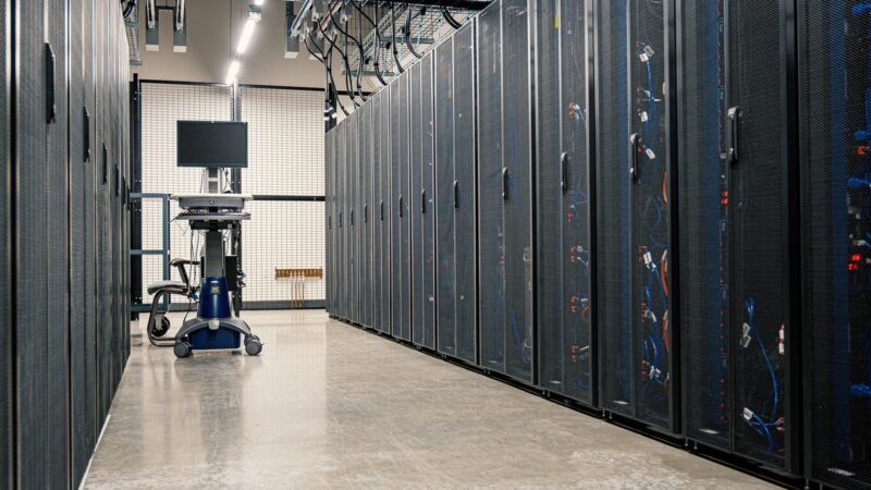 Corridor of server racks in a modern data center