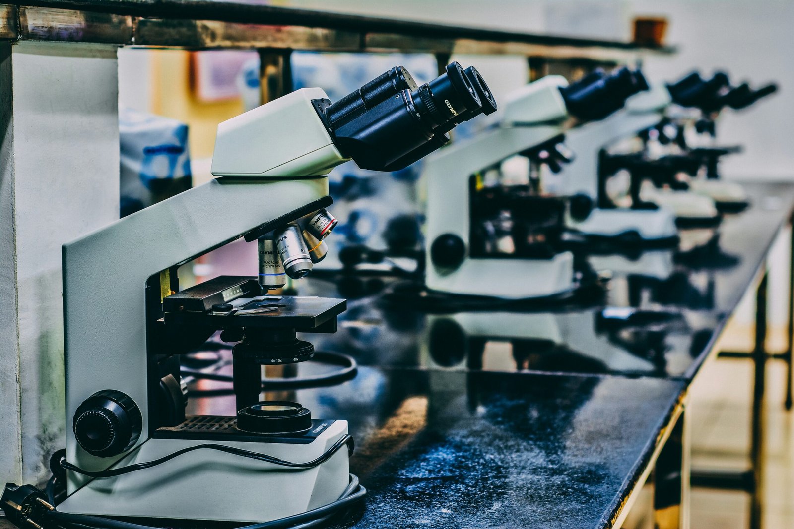 Microscope in a research lab representing the biological data collection behind AI virtual cell models