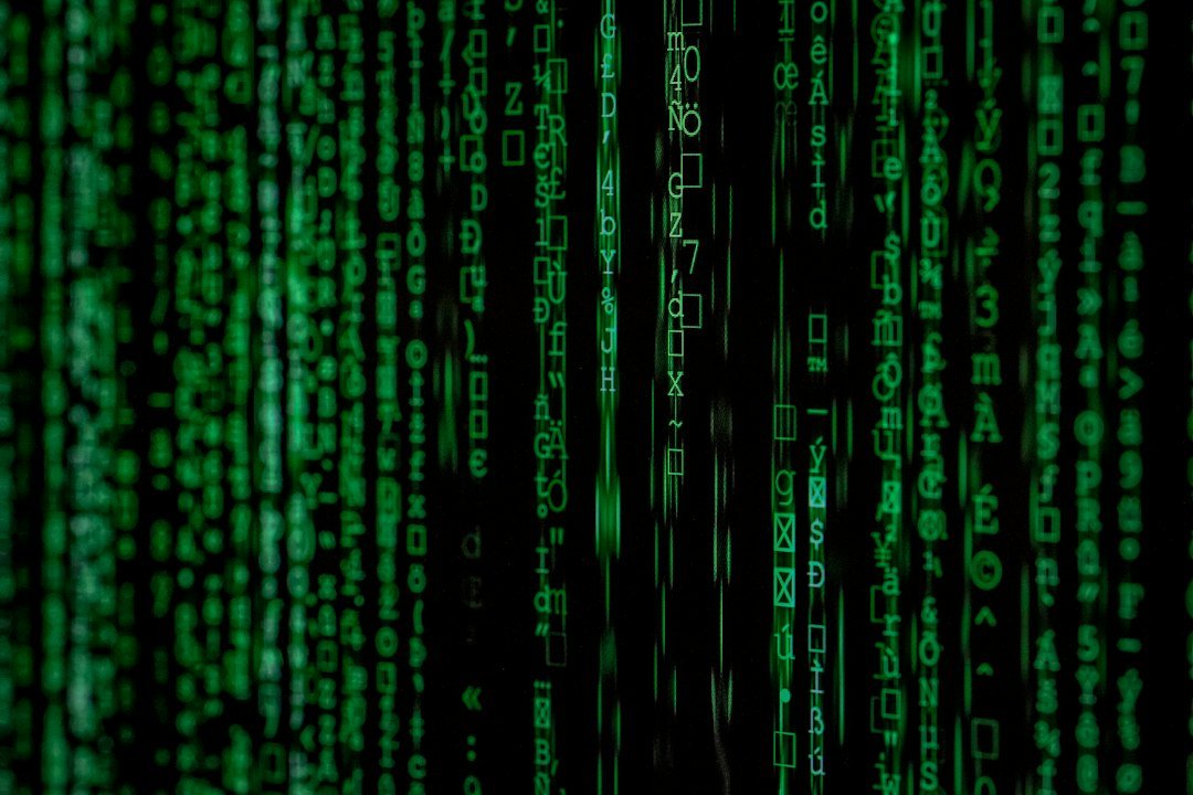 Hacker binary attack code on a screen representing an AI-assisted cyberattack