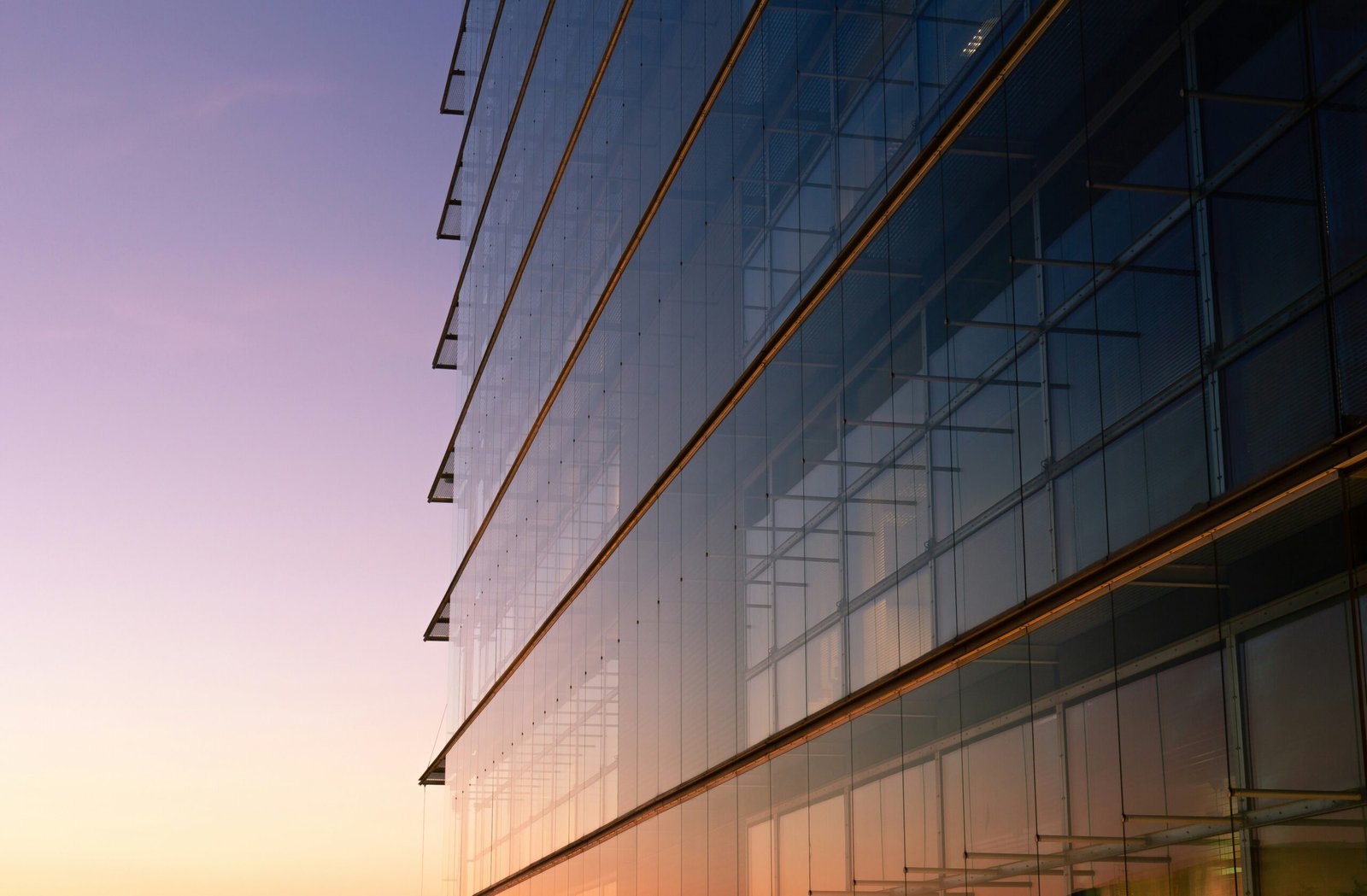 Modern glass corporate office building representing a technology company headquarters