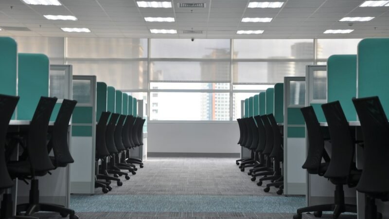 Empty office cubicles symbolizing Netflix cutting about 1,000 jobs