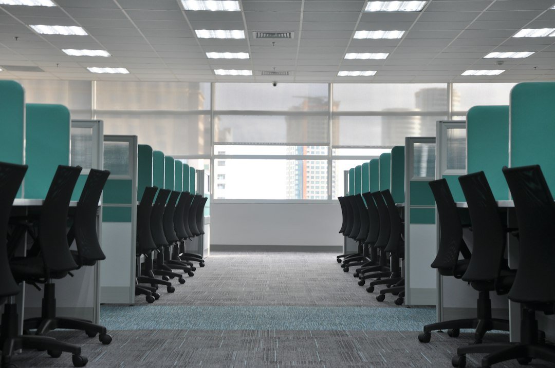 Empty office cubicles symbolizing Netflix cutting about 1,000 jobs