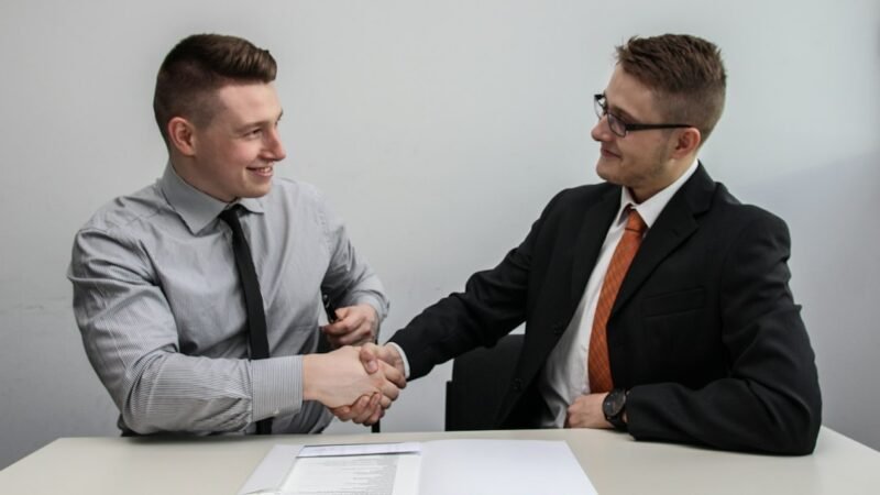 Two businessmen shaking hands, representing a venture capital deal being closed