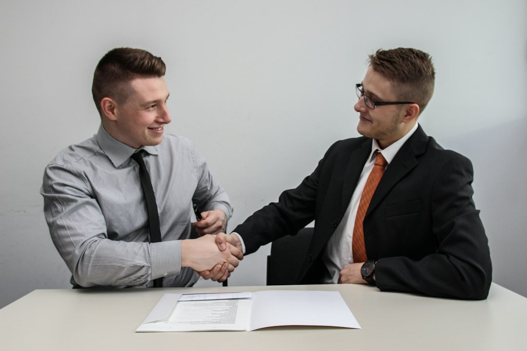 Two businessmen shaking hands, representing a venture capital deal being closed